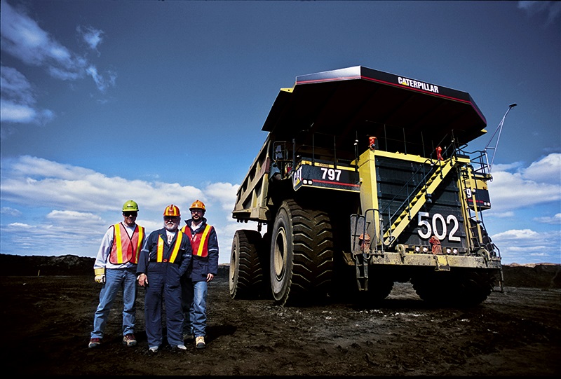 Caterpillar heavy mining trucks on site, ready for pre-start inspection before shift