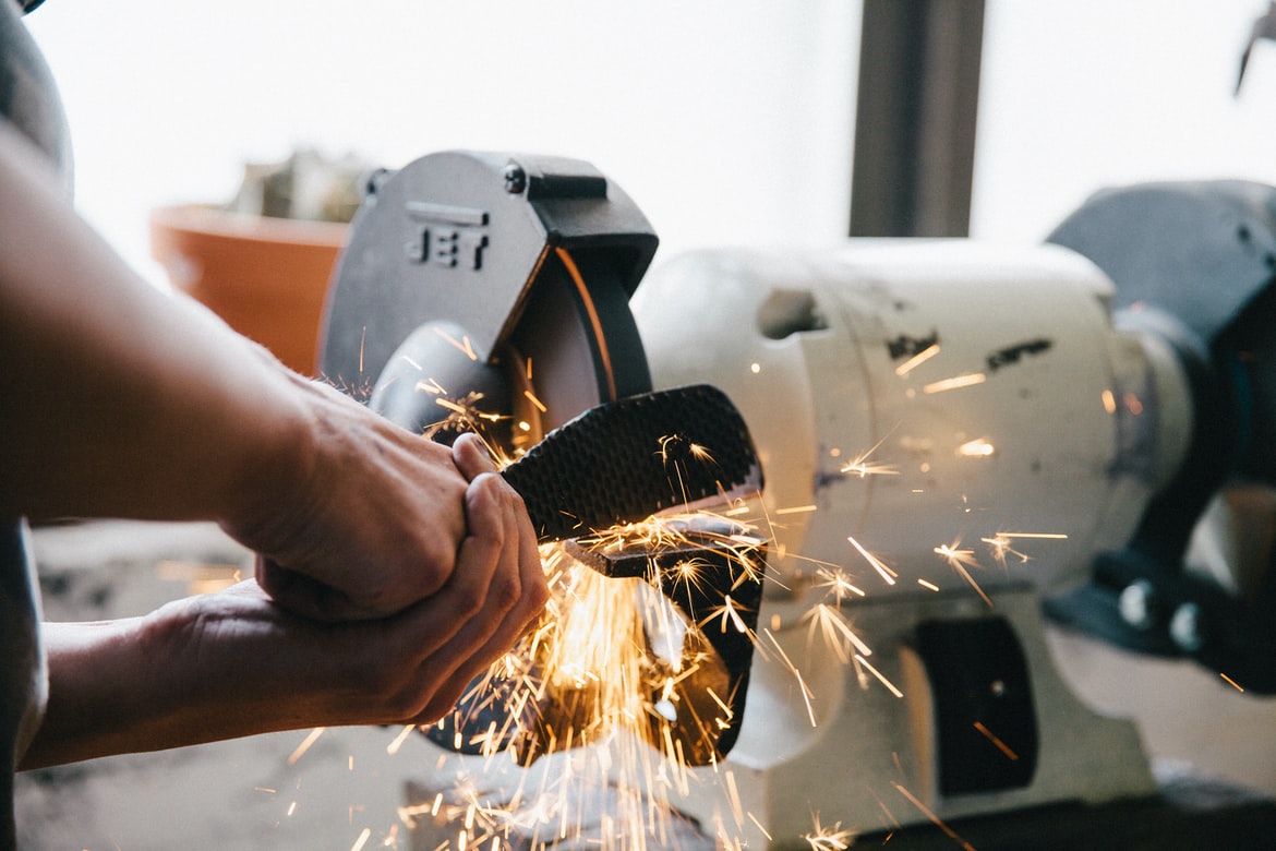 Operator completing a digital pre-start inspection on a mining haul truck
