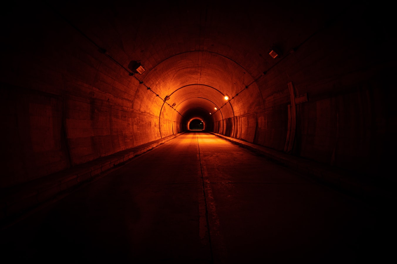 Tunnel inspection engineer conducting a digital safety assessment inside a construction tunnel