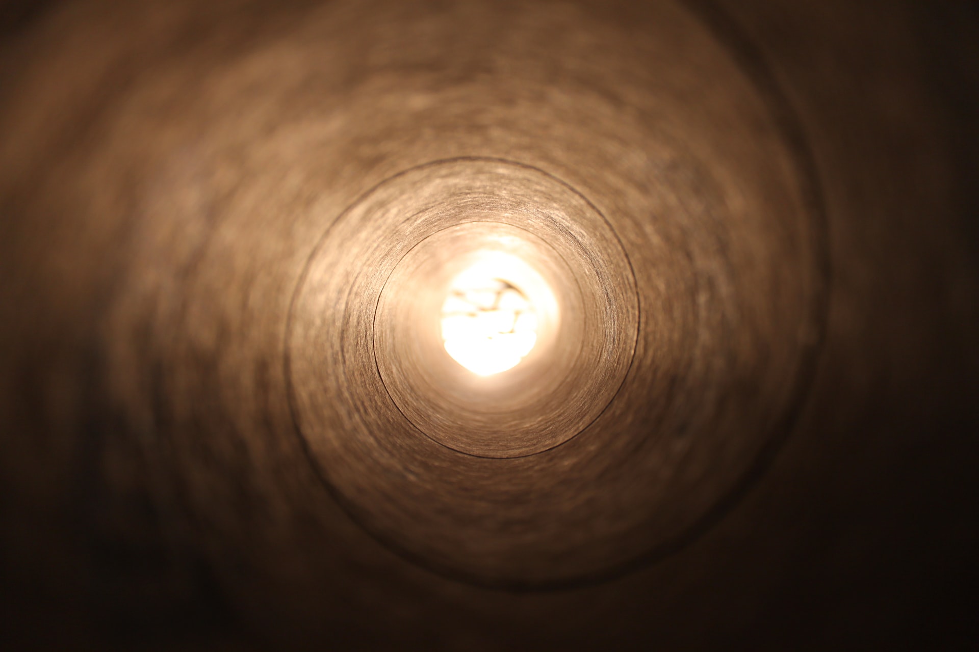 Inspector inside a tunnel using a mobile device to complete a digital inspection checklist
